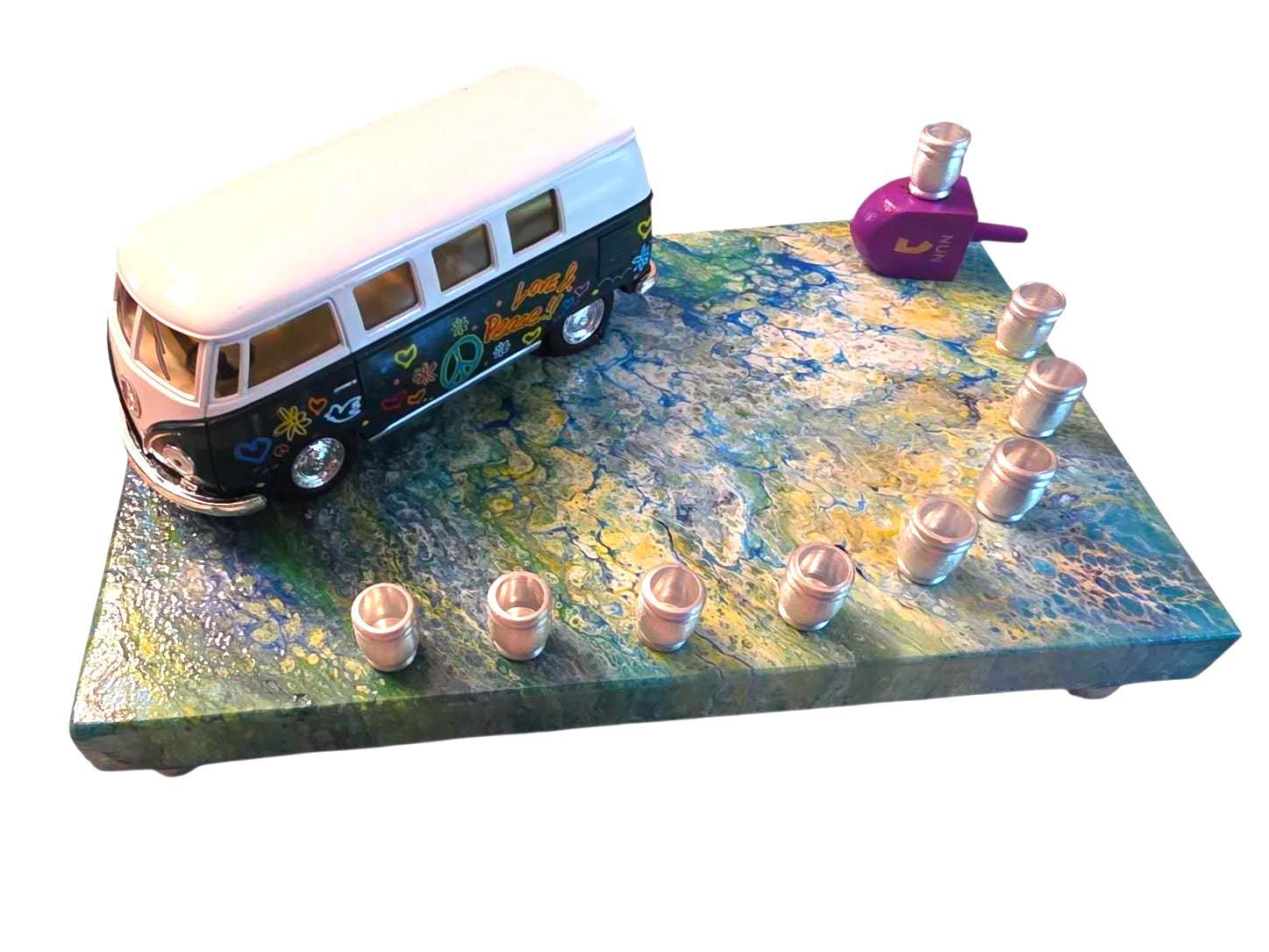 Hippie peace bus menorah — die-cast bus on a swirled acrylic plaque with beads and dreidel | Judaica Square Lakewood (view 2)