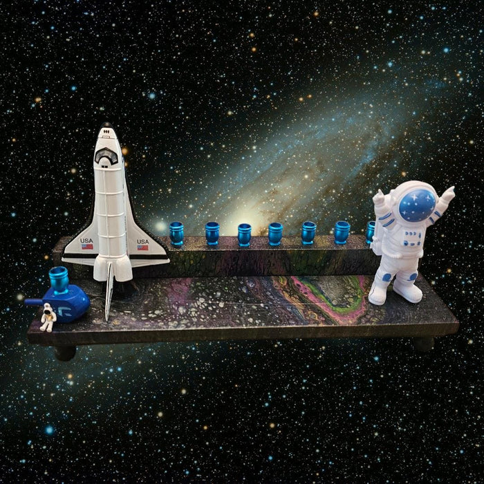 Outer space menorah — die-cast rocketship and astronaut on paint-poured base | Judaica Square Lakewood