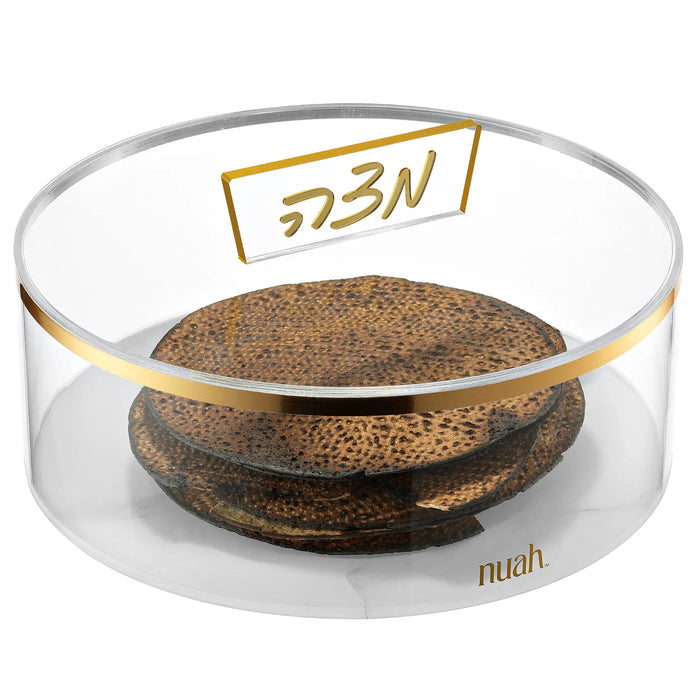 Round clear acrylic matzah box with gold band and gold-framed Matzah knob, holding round matzos