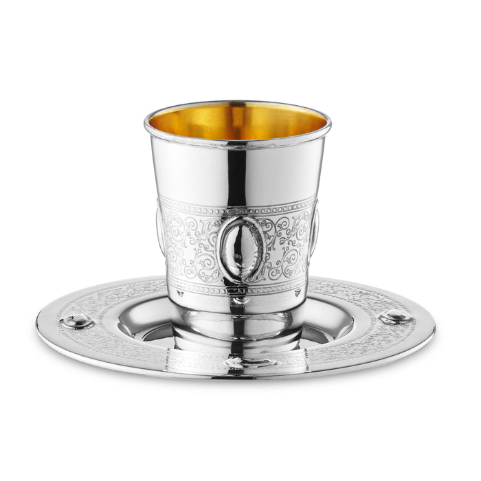 Silver-coated Kiddush cup with engraved oval-medallion belt on a matching plate with raised ovals
