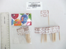 Pack of Shabbat Shalom toothpick flags with loose flags beside it, ruler for scale