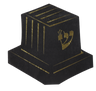 Black napkin cut in a tefillin shape with gold foil stripes and a gold Hebrew shin