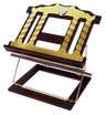 Wooden two-tone book stand tilted up on its gold wire support, gold laser-cut pillar design across the front plate with a round white clock face at the top center