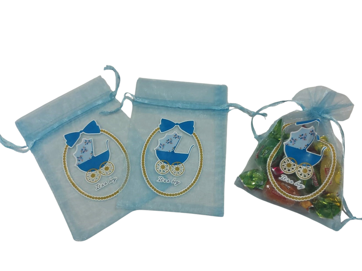 Three light blue organza bags with baby carriage print, one filled with wrapped candy