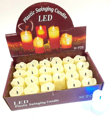 Display box of 24 ivory LED plastic candles with drip-edge tops, one candle lit beside the box