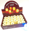 Display box of 24 ivory LED plastic candles with drip-edge tops, one candle lit beside the box
