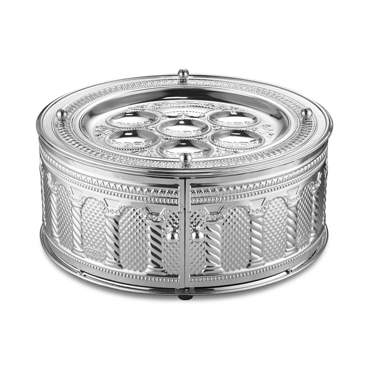 Round three-tier silver-plated seder plate with embossed columns and lattice panels, two front doors with ball handles and six Hebrew-labeled dishes on the top plate