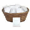 Wicker basket filled with mini white Tehillim books with silver Hebrew titles in clear cases