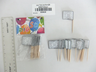 Wooden toothpick flags with silver-framed Hebrew Mazal Tov, in and out of their packet