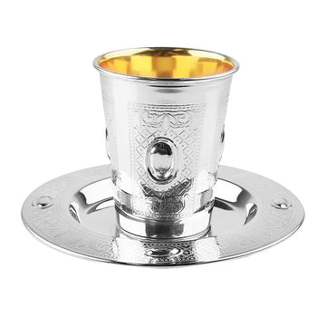 Silver-coated Kiddush cup with framed lattice panels and oval medallions on a matching engraved plate