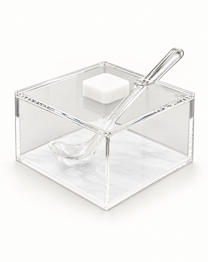 Square clear acrylic honey dish over a white pearl base panel, flat lid with a white square knob and a clear acrylic spoon set through the lid slot