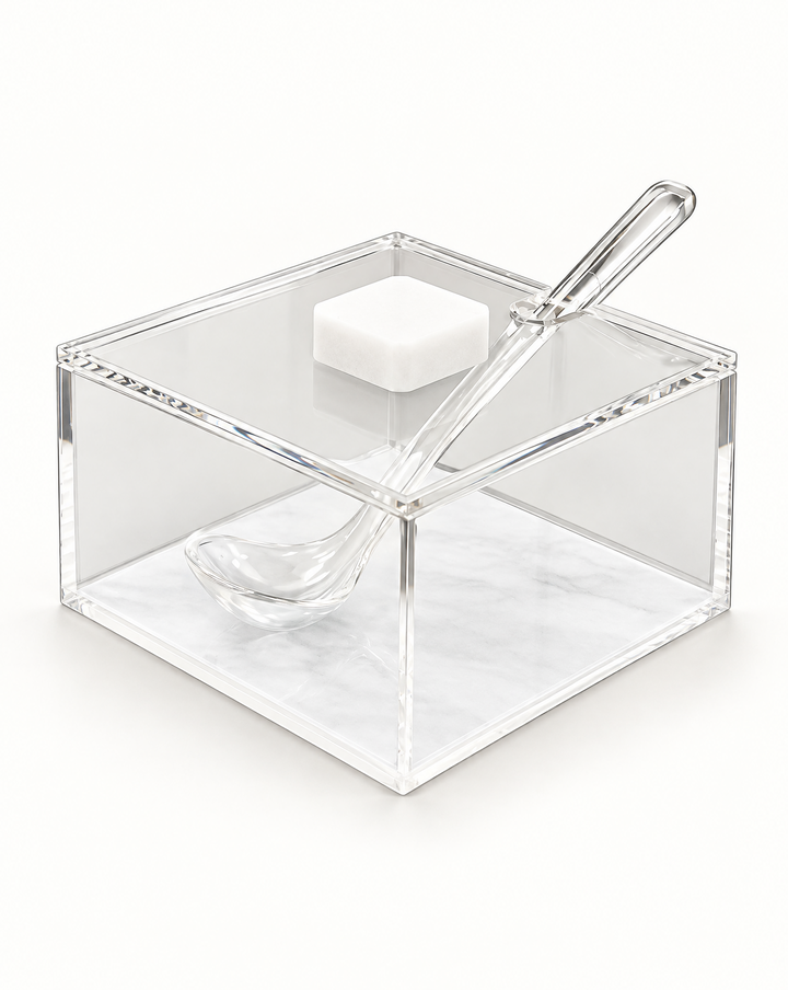 Square clear acrylic honey dish over a white pearl base panel, flat lid with a white square knob and a clear acrylic spoon set through the lid slot