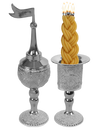 Silver-plated filigree besamim holder with a pointed dome and flag finial beside a matching filigree candle holder with a lit braided havdalah candle in it