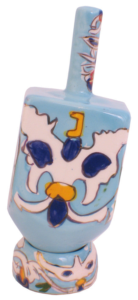 Karshi ceramic dreidel painted with dark blue flowers on light blue with matching stand
