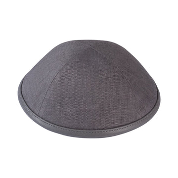 Slate grey linen kippah with a slightly lighter grey leather rim, side view