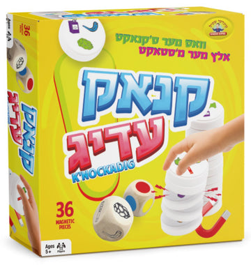 K'nakedig yellow game box showing a hand stacking white magnetic discs beside two picture dice