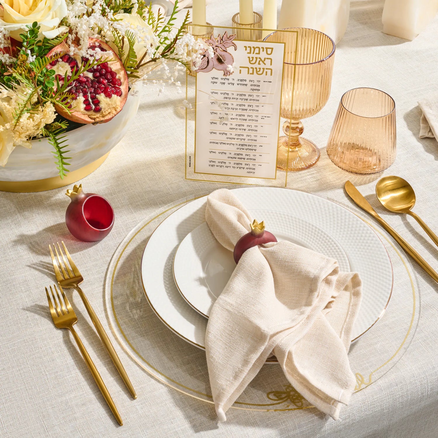 White marble-look pomegranate napkin ring at a table setting