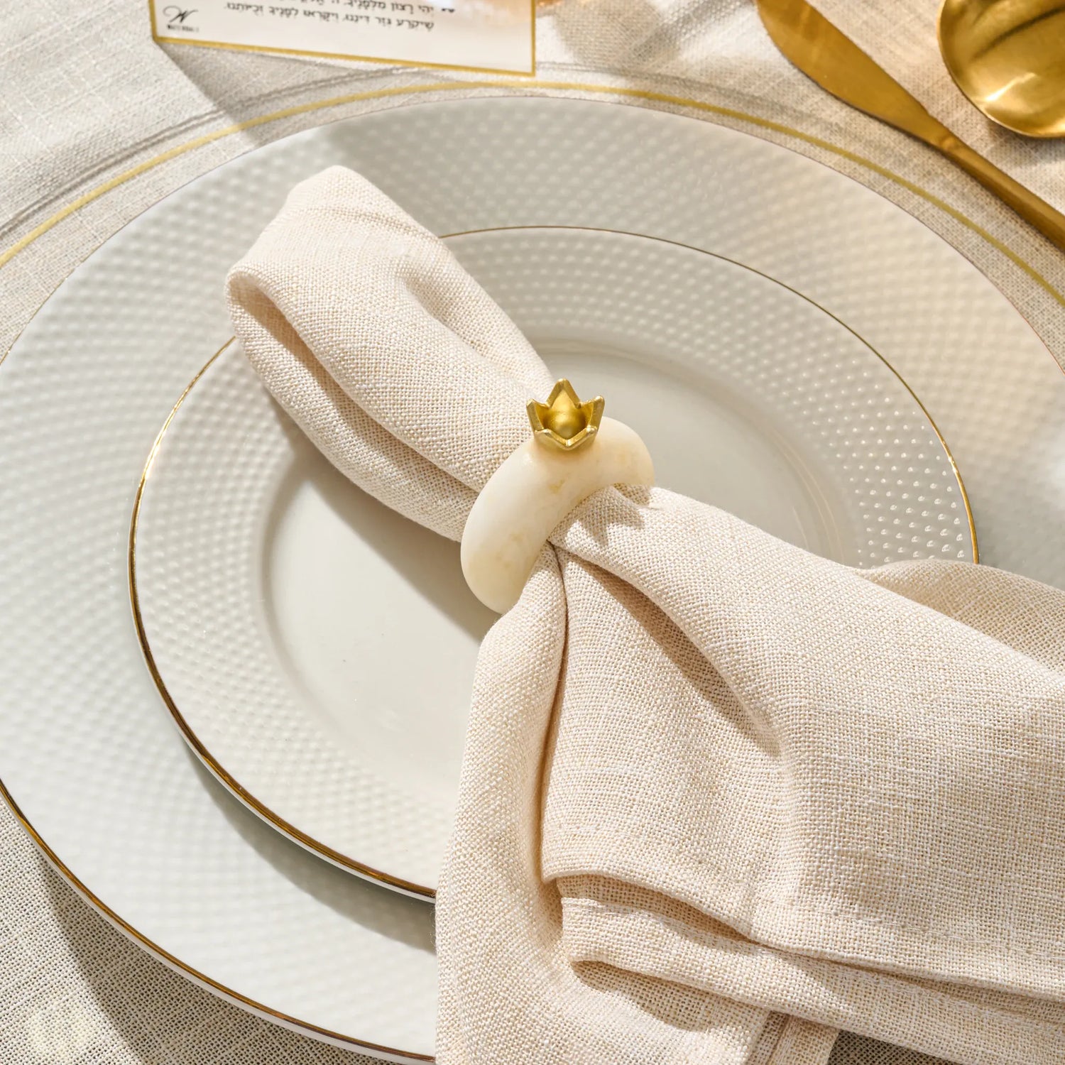 Set of four white marble-look pomegranate napkin rings