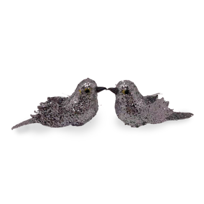 Two silver glitter-finish dove decorations facing each other