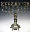 Satin gray pewter menorah with S-curved arms, decorated banded column and hexagonal footed base