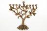 Antiqued gold-tone pomegranate tree menorah with leaves and fruit on a textured trunk