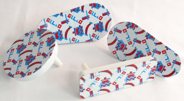 Assorted shaped tin Purim graggers with blue and red Purim lettering