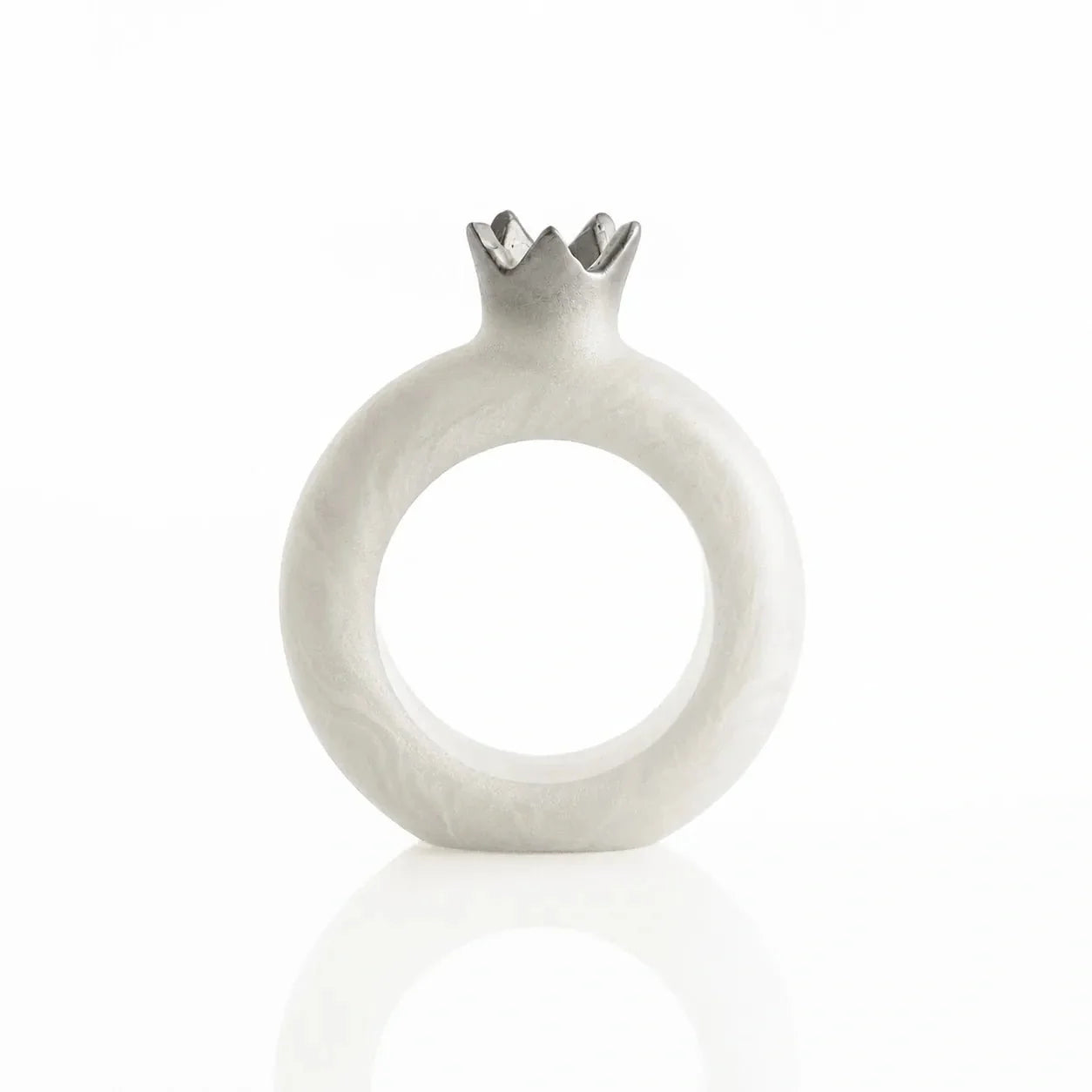 Close view of sculpted resin pomegranate napkin ring