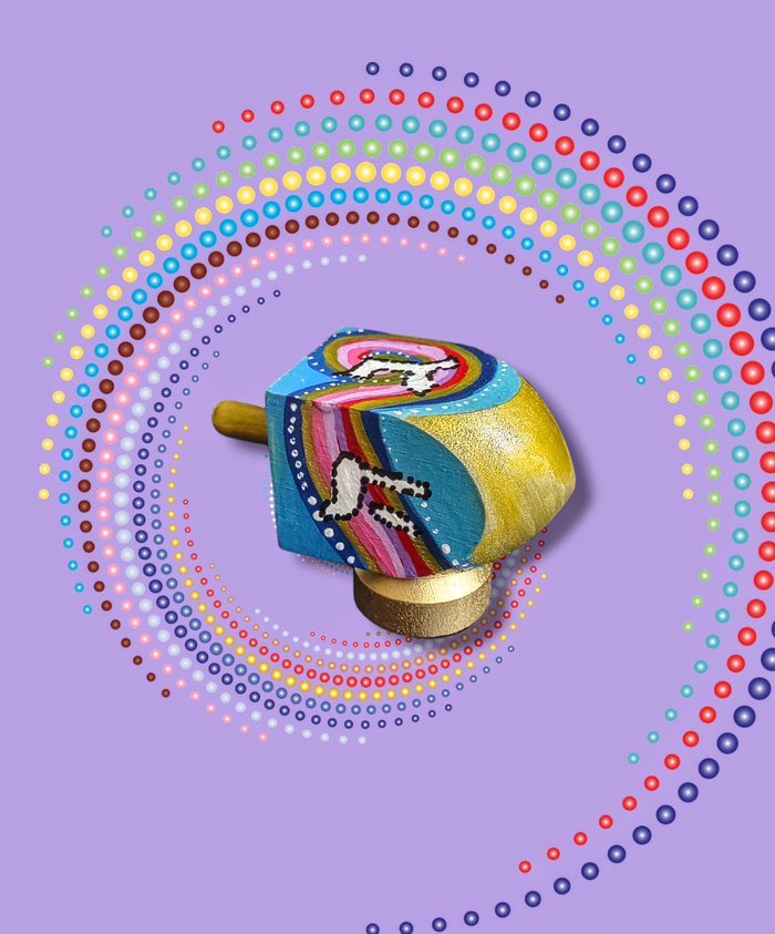 Brightly colored dreidel — wooden dreidel painted in bold colors with its wooden stand | Judaica Square Lakewood