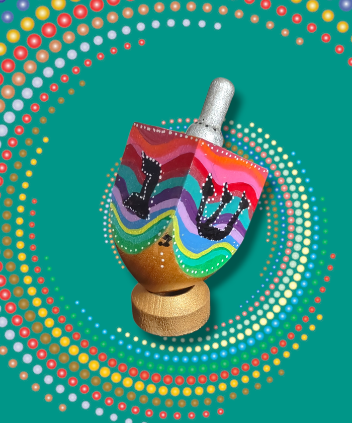 Swirl dreidel — colorful hand-painted wooden dreidel with swirling stripes on a stand | Judaica Square Lakewood