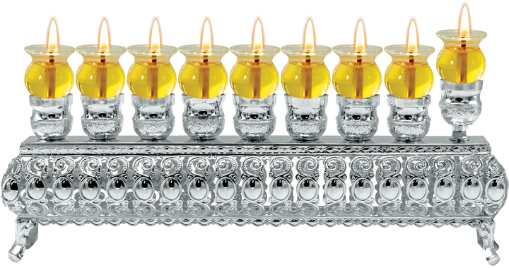 Low silver-plated oil menorah with lit glass cups in a row on an ornate footed bench