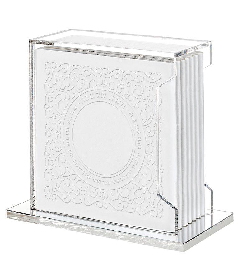 Simchonim Lucite stand holding Lacey style Haggados in white