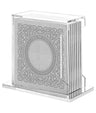 Simchonim Lucite stand holding Lacey style Haggados in silver
