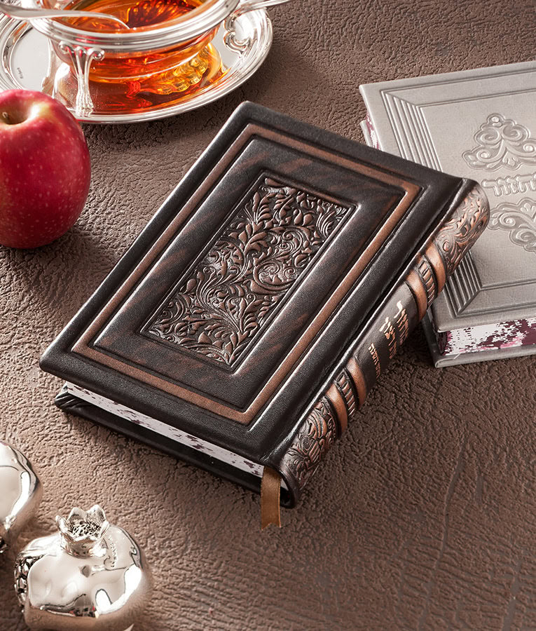Simchonim Royal series genuine leather machzor set, shown on a table setting