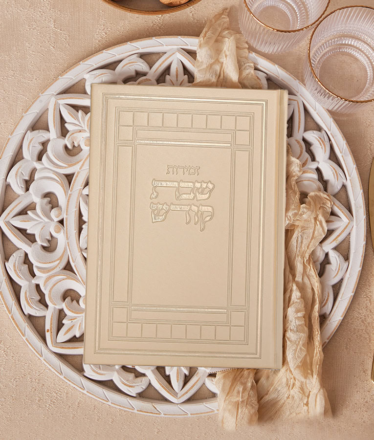 Simchonim Kodesh style extra large zemiros, shown on a table setting