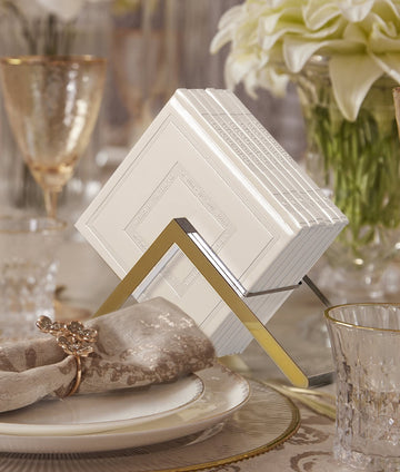 Simchonim Lucite stand holding Noam style zemiros, shown on a table setting