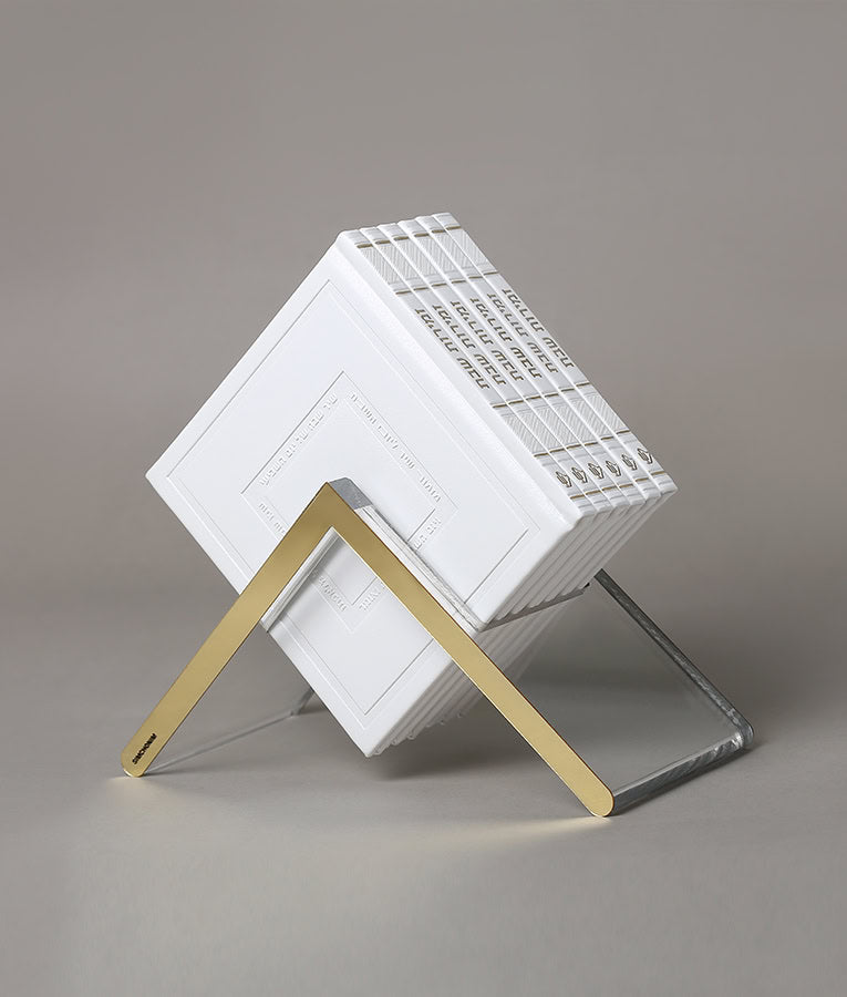 Simchonim Lucite stand holding Noam style zemiros in white