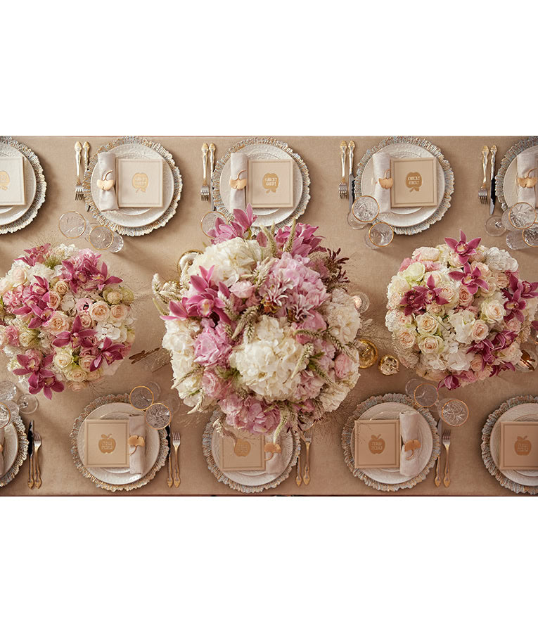 Simchonim apple style Shanah Tovah booklet, shown on a table setting