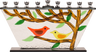 Glass menorah with a red and a yellow bird on a branch