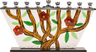 Glass menorah with red flowers on brown branches