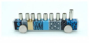 Truck-shaped menorah with blue patterned panels, silver cups and round wheels
