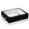 Black lucite 9x13 pan holder with a foil pan seated inside, clear lid with knob and gold side handles