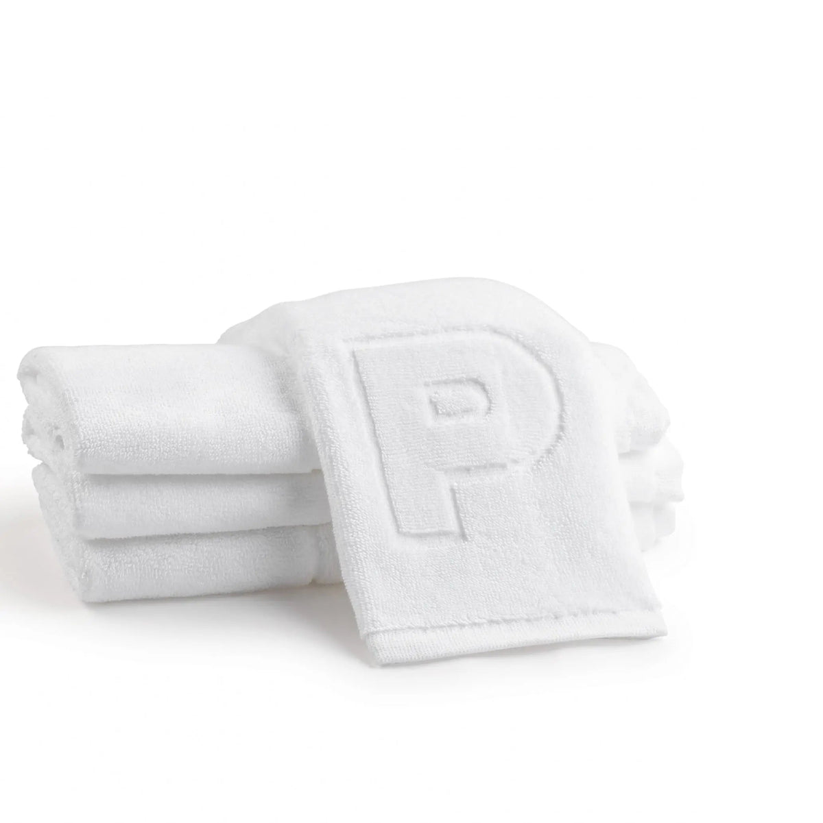 White cotton finger towel set embossed with the letter P, two towels folded