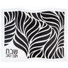 Black leather challah cover under a white cut-out leaf overlay with Shabbos V'Yom Tov corner text