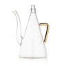 Clear glass oil jug with a conical body, long curved spout, gold handle and glass stopper