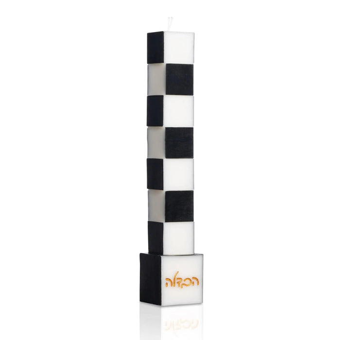Onyx Havdalah Candle, a tall freestanding black and white checkered candle on a black base with embossed gold הבדלה lettering