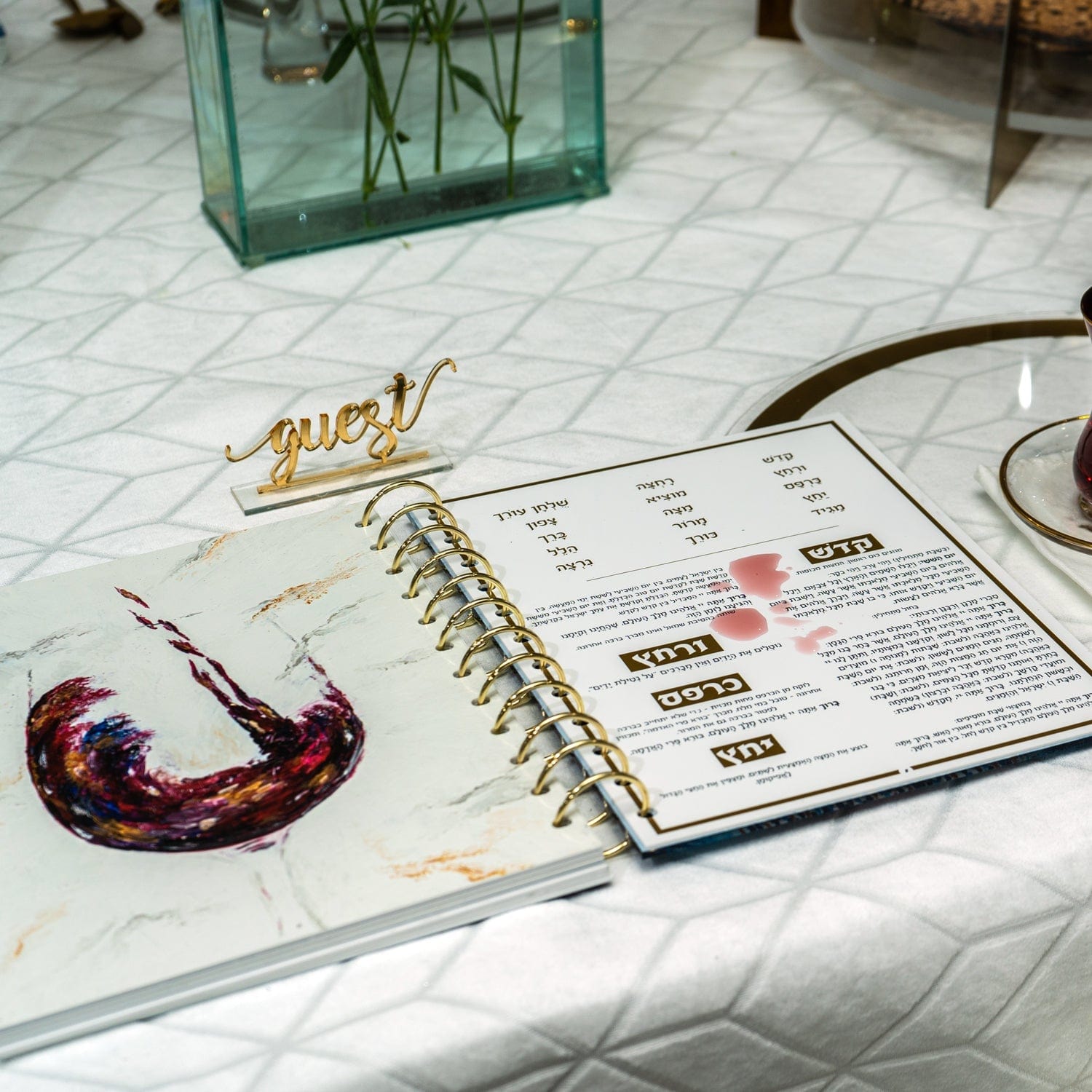 Painted Krias Yam Suf Haggadah — lifestyle shot | Judaica Square Lakewood