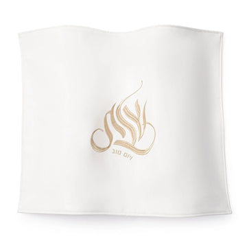Gold Regal Challah Cover with embroidered Shabbos Yom Tov script, flat lay