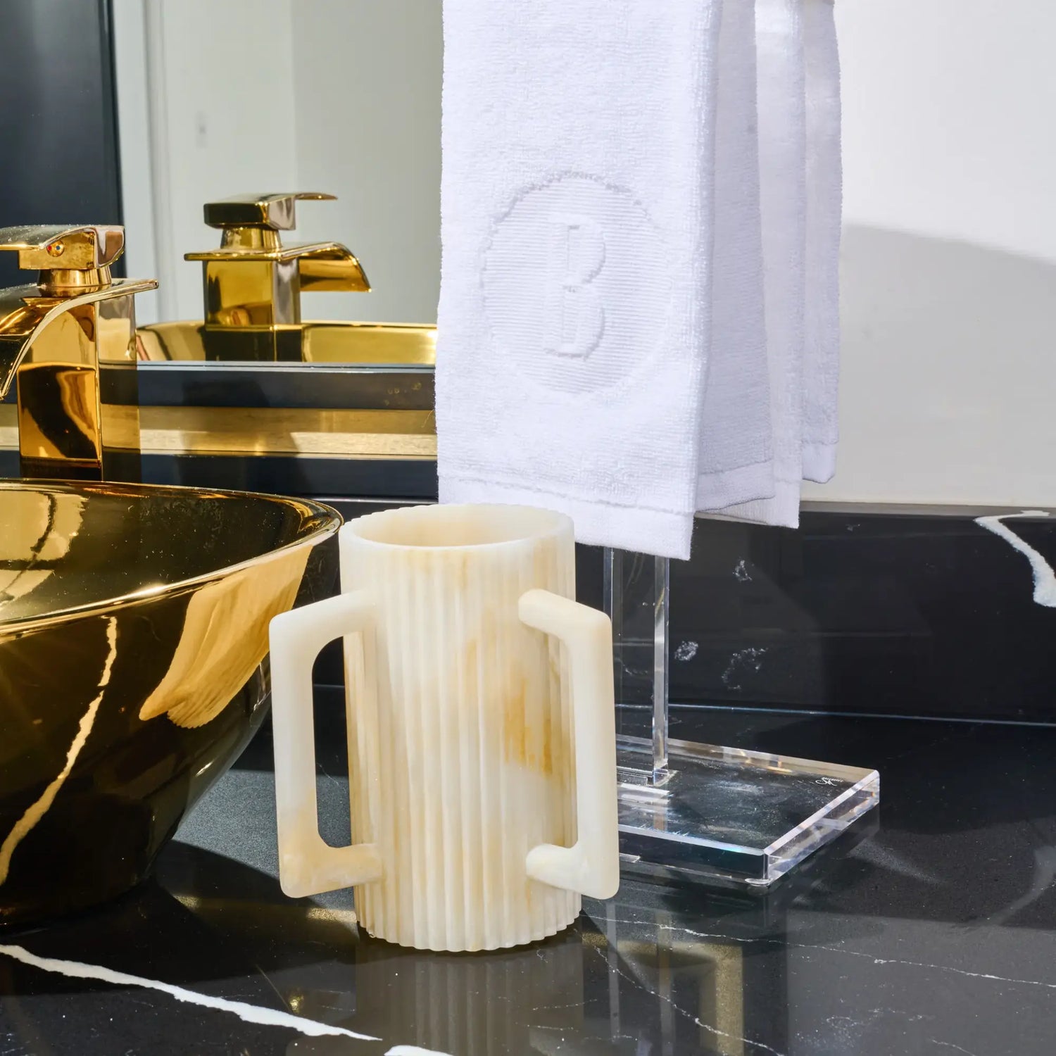 Marble Waterdale fluted resin washing cup beside a handwashing basin