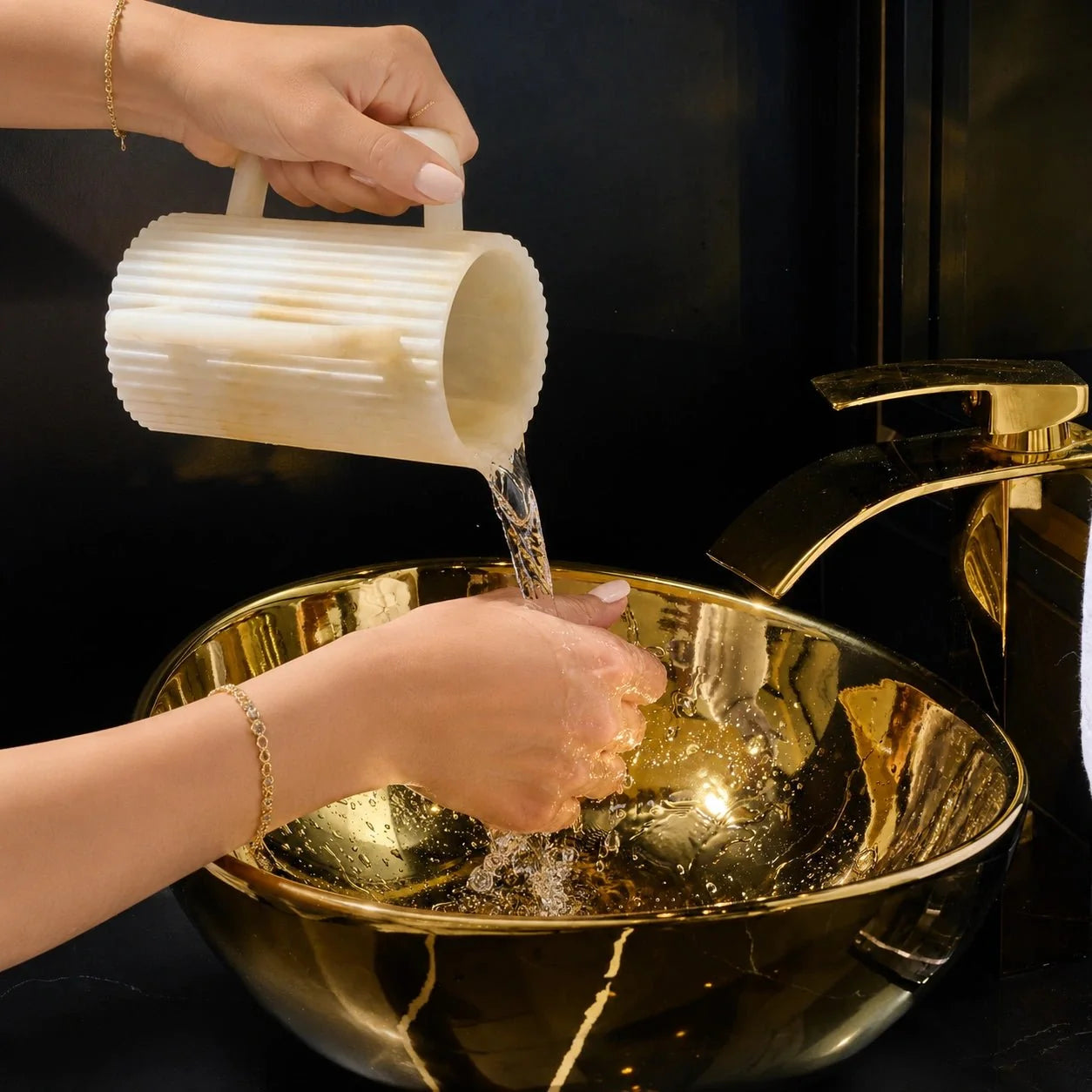 White Gold Waterdale fluted resin cup pouring water for handwashing