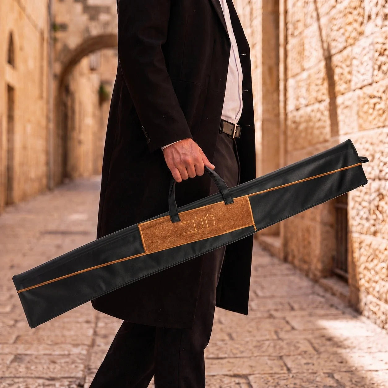 Black Waterdale geometric lulav case shown carried by its handle